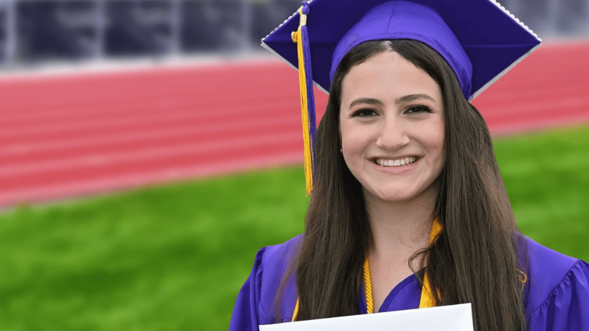 Confident young patient celebrating after orthodontic treatment